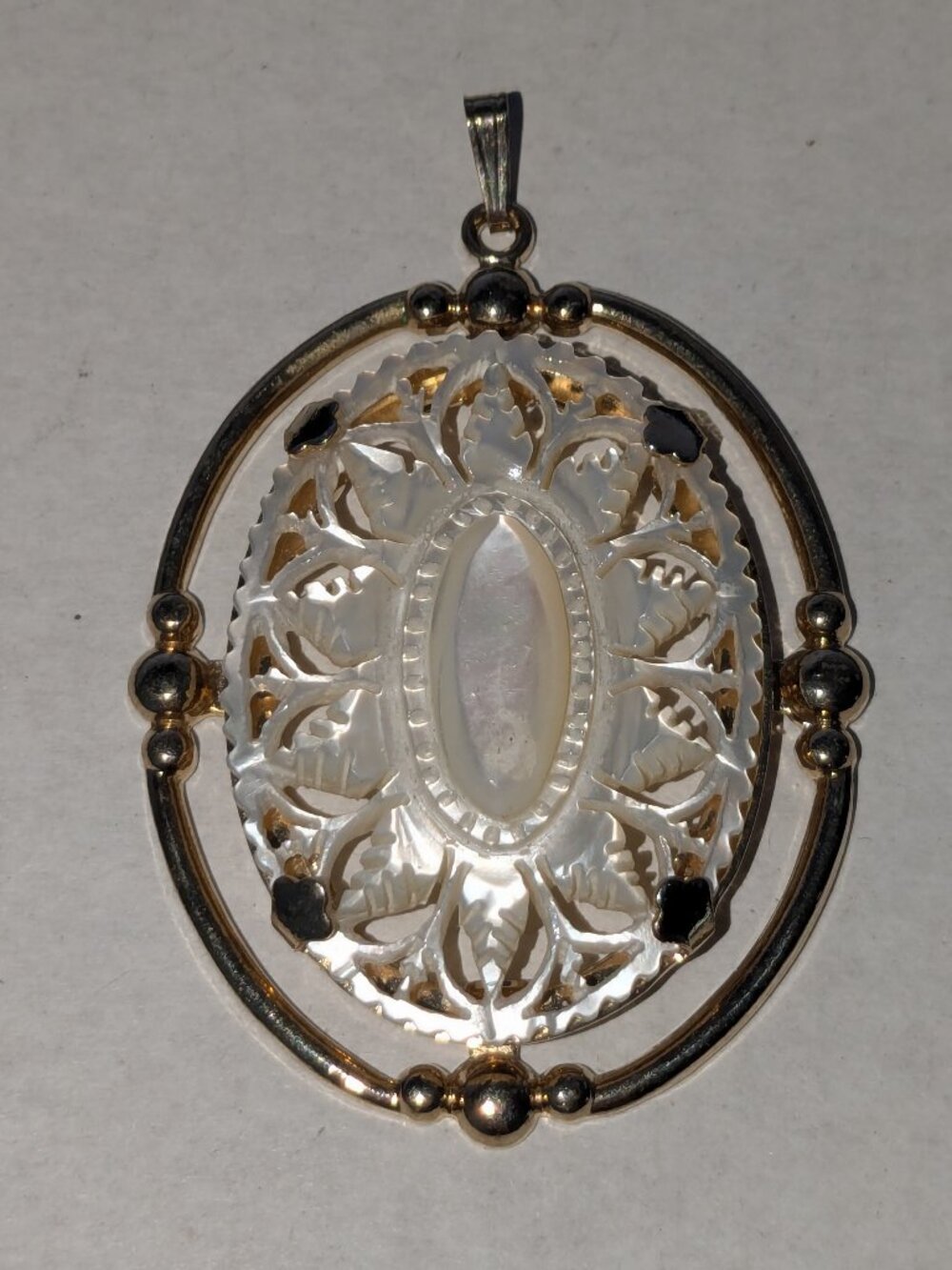 MOP Mother of Pearl Carved Oval Gold Tone Pendant